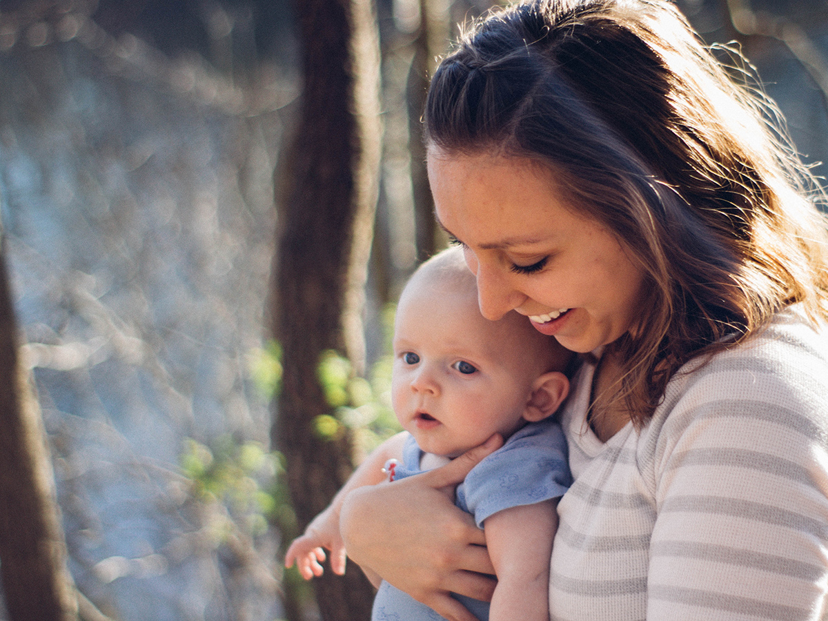 A photo of a woman holding a baby.