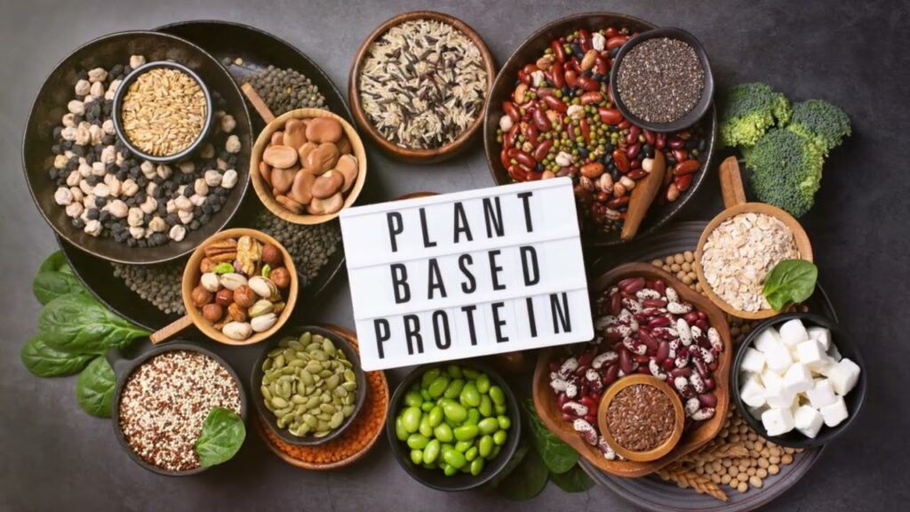 A colorful assortment of nutrient-dense Superfoods for Optimal Health, including berries, dark leafy greens, nuts, and seeds, displayed on a rustic wooden table.